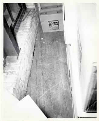 Photograph of spent rifle shells found on the floor