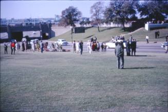 Image of crowds and flowers in Dealey Plaza