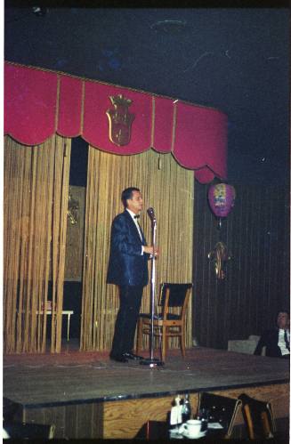 Image of Wally Weston on stage at the Carousel Club