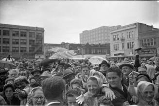 Image of President Kennedy with crowds outside the Hotel Texas