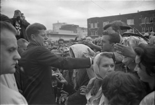 Image of President Kennedy with crowds outside the Hotel Texas