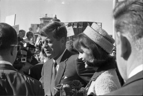 Image of the Kennedys walking toward the crowd at Love Field