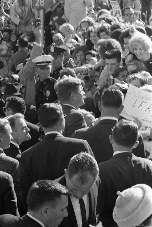 Image of the Kennedys greeting the crowd at Love Field