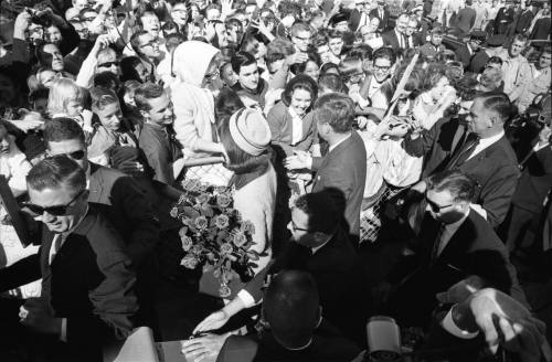 Image of the Kennedys greeting the crowd at Love Field