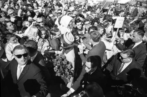 Image of the Kennedys greeting the crowd at Love Field