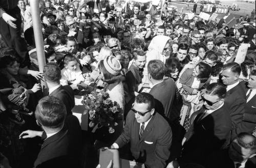 Image of the Kennedys greeting the crowd at Love Field