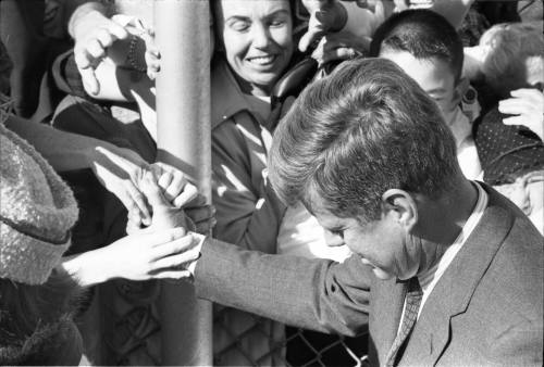Image of President Kennedy greeting the crowd at Love Field