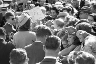 Image of the Kennedys greeting the crowd at Love Field