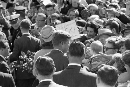 Image of the Kennedys greeting the crowd at Love Field