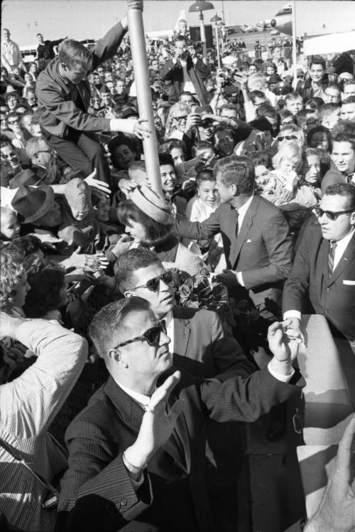 Image of the Kennedys greeting the crowd at Love Field