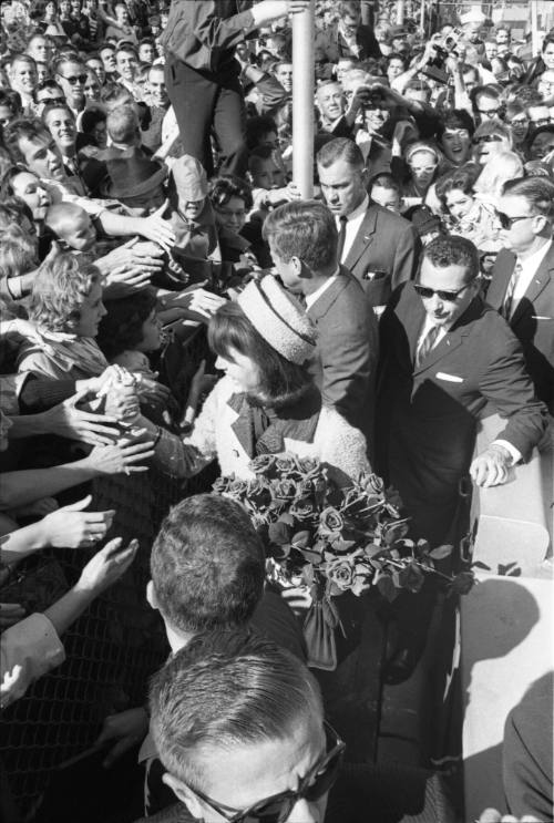 Image of the Kennedys greeting the crowd at Love Field