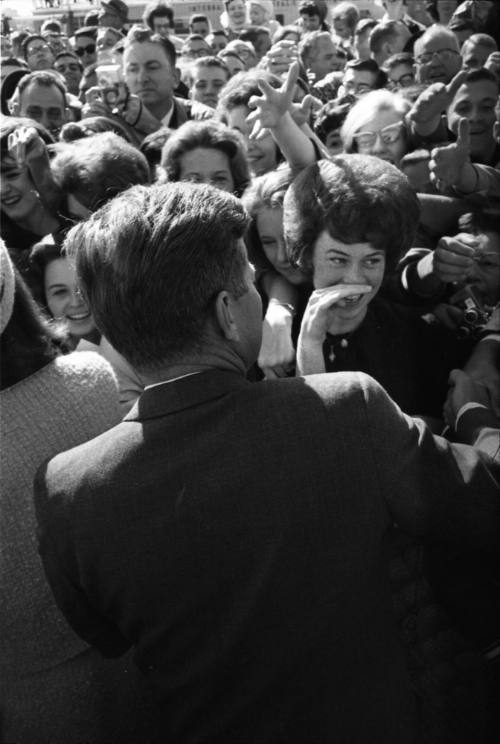 Image of President Kennedy greeting the crowd at Love Field
