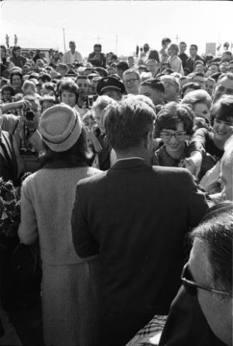 Image of the Kennedys greeting the crowd at Love Field