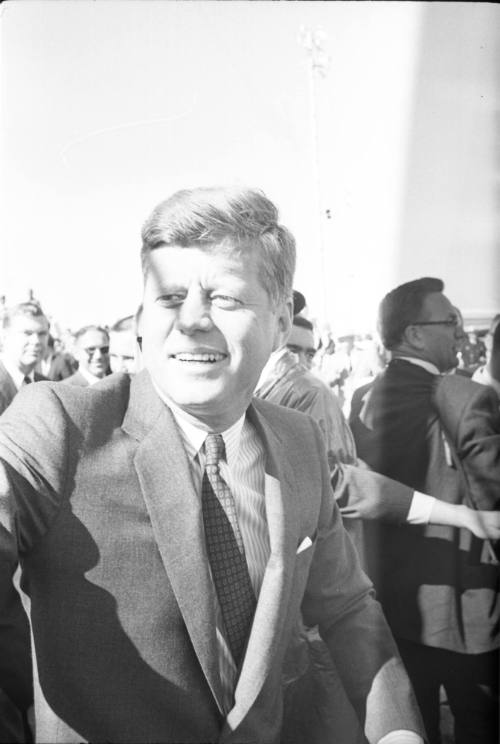 Image of President Kennedy greeting the crowd at Love Field