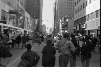 Image of the crowd on Main Street after the presidential motorcade passed by