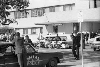 Image of the president's hearse leaving Parkland Hospital