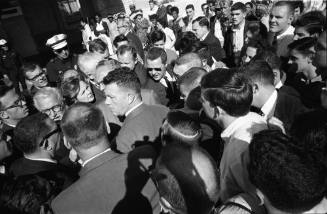 Image of members of the press conducting interviews outside of Parkland Hospital