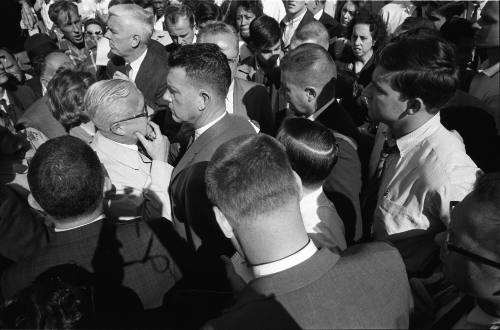 Image of members of the press interviewing people outside of Parkland Hospital