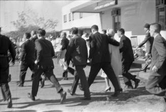 Image of Lady Bird Johnson leaving Parkland Hospital