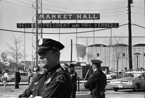 Image of Dallas police officers standing guard at the Dallas Trade Mart