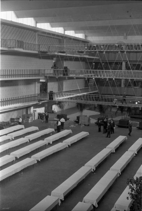 Image of banquet tables being set up at the Dallas Trade Mart