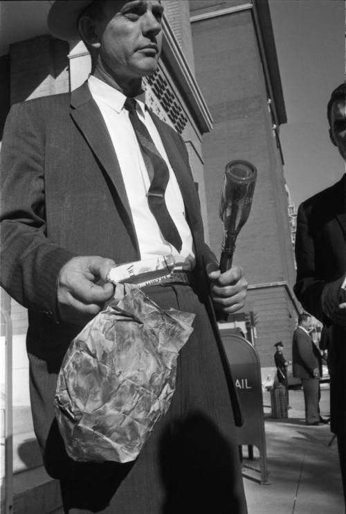 Image of a Dallas Police detective outside the Texas School Book Depository