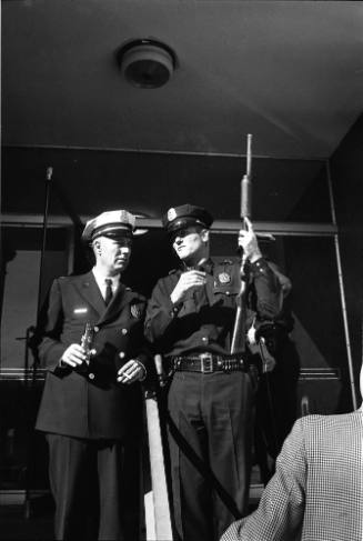 Image of police officers at the entrance to the Texas School Book Depository