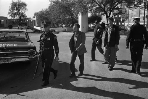 Image of the "three tramps" being escorted to the Sheriff's office