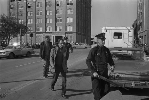 Image of the "three tramps" being escorted to the Sheriff's office