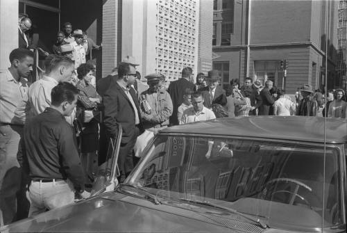 Image of a crowd outside of the Texas School Book Depository