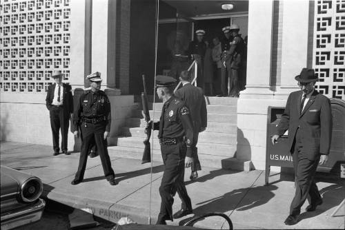 Image of Dallas Police officers outside the Texas School Book Depository