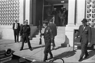 Image of Dallas Police officers outside the Texas School Book Depository