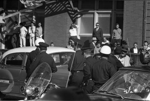 Image of Dallas Police officers in the intersection of Elm and Houston streets
