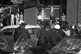 Image of Dallas Police officers in the intersection of Elm and Houston streets