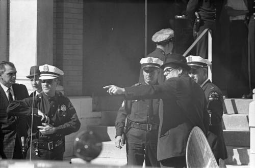 Image of Dallas Police officers outside the Texas School Book Depository