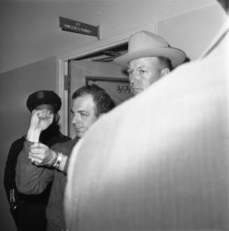 Image of Lee Harvey Oswald at Dallas Police headquarters on November 22, 1963