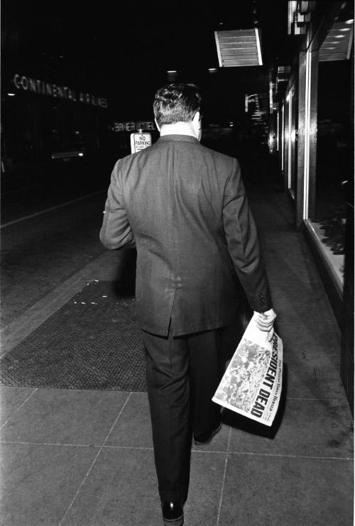 Image of a man in downtown Dallas on the evening of November 22, 1963