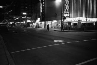 Image of Commerce Street in downtown Dallas the evening of November 22, 1963