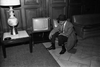 Image of a man watching KRLD-TV Channel 4