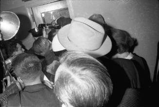 Image of a crowd at the entrance to the Homicide and Robbery Bureau