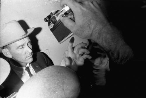 Image of a detective in the hallway at Dallas Police Headquarters