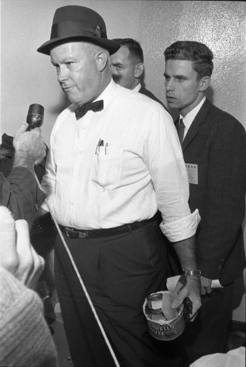 Image of a Dallas Police detective with materials for the paraffin test