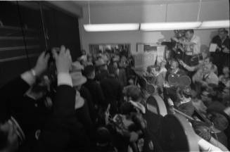 Image of Lee Harvey Oswald being escorted from the midnight press showing