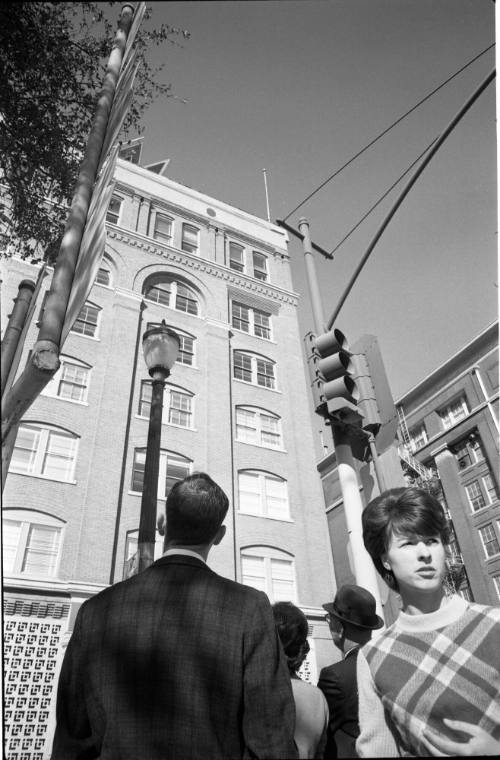 Image of a crowd on Elm Street looking at the Texas School Book Depository