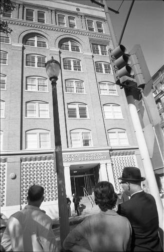 Image of a crowd on Elm Street looking at the Texas School Book Depository