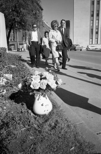 Image of memorial flowers for President Kennedy on Elm Street