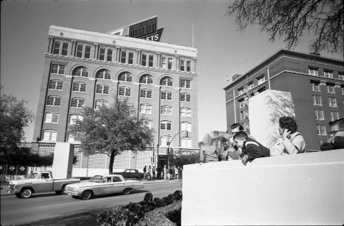 Image of people in Dealey Plaza the day after the assassination