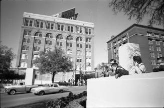 Image of people in Dealey Plaza the day after the assassination