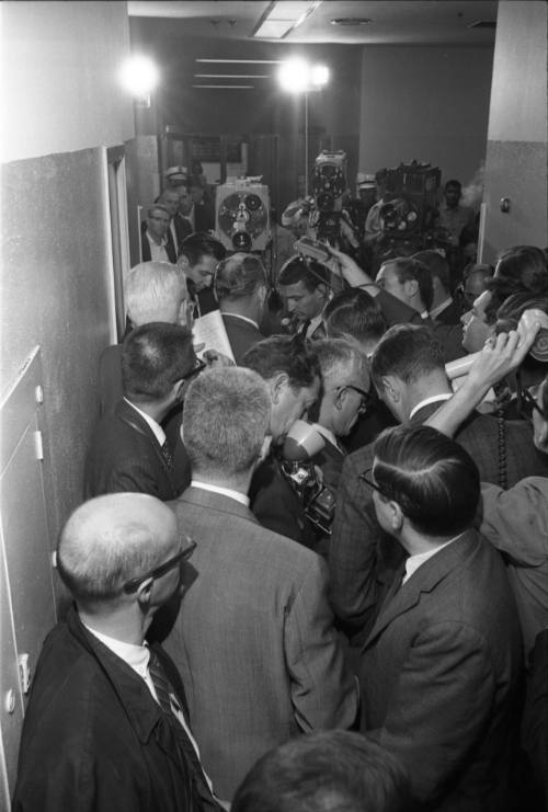 Image of Dallas Police Chief Jesse Curry interviewed in hallway