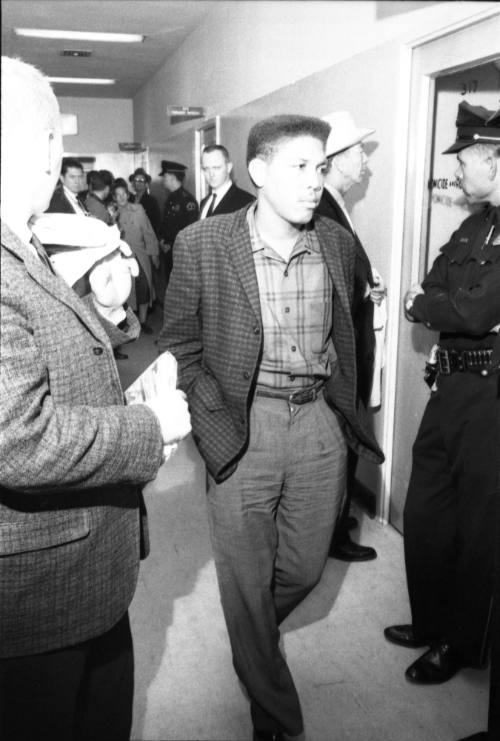 Image of an unidentified man in a Dallas Police Department hallway